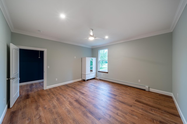 spare room featuring dark hardwood / wood-style floors, ceiling fan, crown molding, and a baseboard radiator