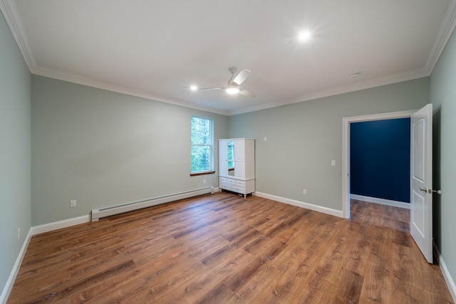 interior space with hardwood / wood-style floors, baseboard heating, and crown molding