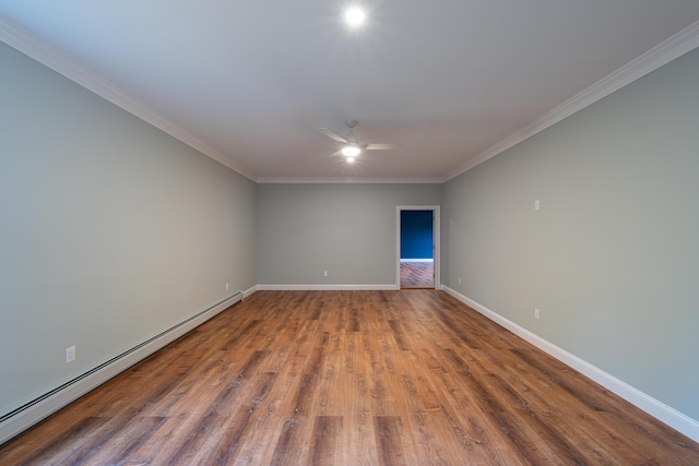 empty room featuring crown molding, ceiling fan, wood-type flooring, and a baseboard heating unit