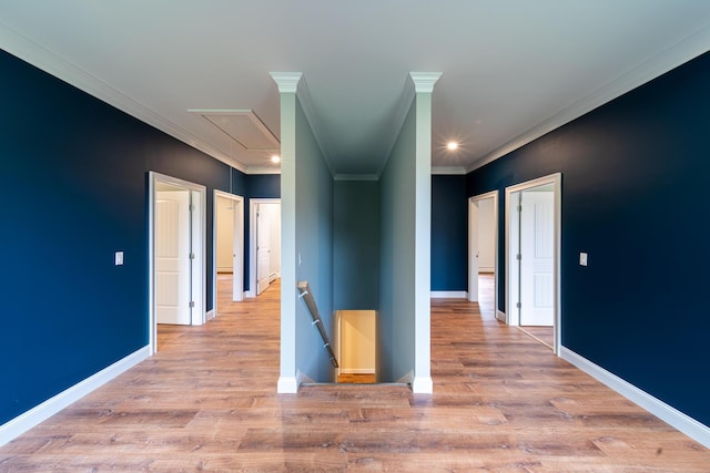 corridor featuring ornamental molding and light wood-type flooring