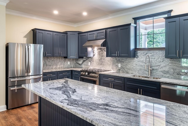 kitchen featuring sink, dark hardwood / wood-style floors, decorative backsplash, appliances with stainless steel finishes, and light stone counters