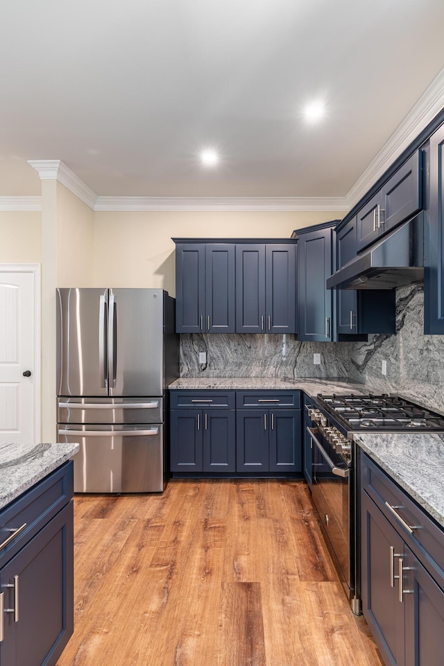 kitchen with light stone countertops, backsplash, appliances with stainless steel finishes, and ornamental molding