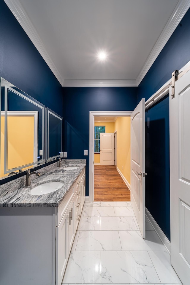 bathroom with vanity and ornamental molding