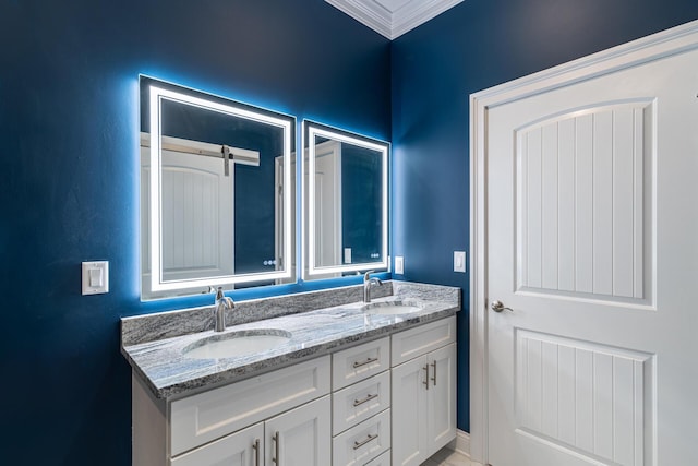 bathroom featuring crown molding and vanity