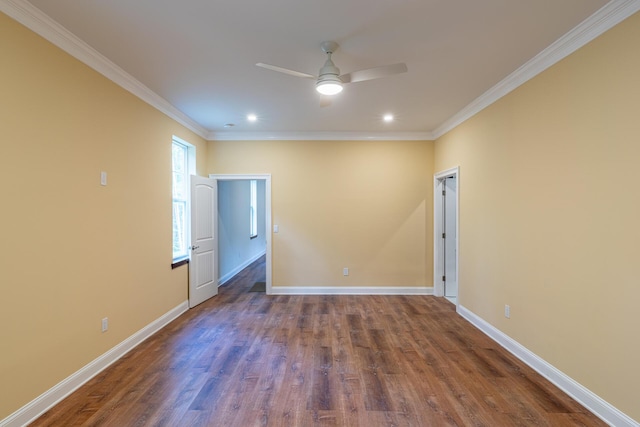 empty room with ceiling fan, dark hardwood / wood-style flooring, and ornamental molding