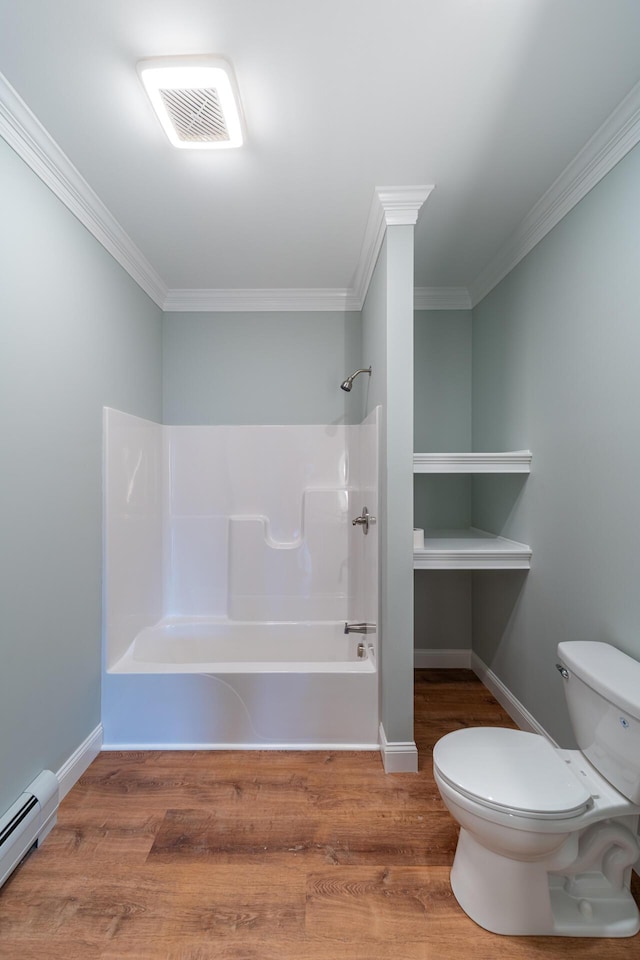 bathroom with a baseboard radiator, crown molding, toilet, shower / washtub combination, and hardwood / wood-style flooring