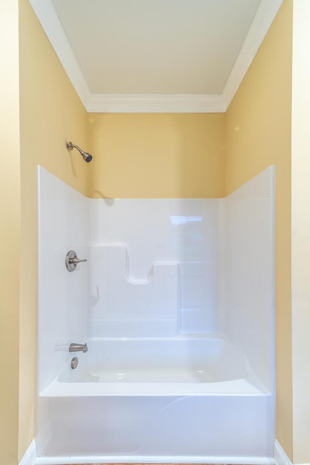 bathroom featuring bathtub / shower combination and ornamental molding