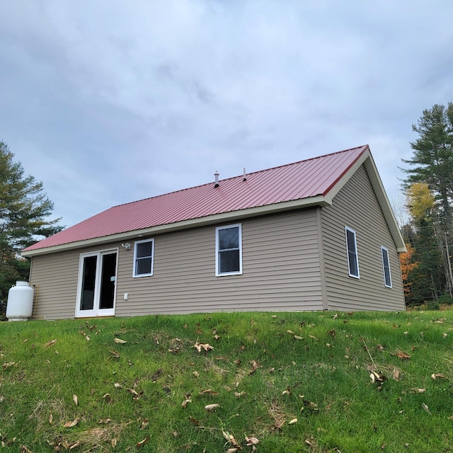 rear view of house with a lawn