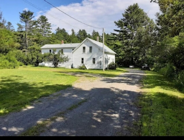 view of home's exterior with a yard