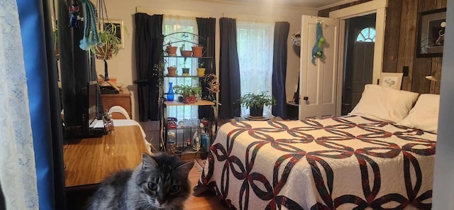 bedroom with crown molding