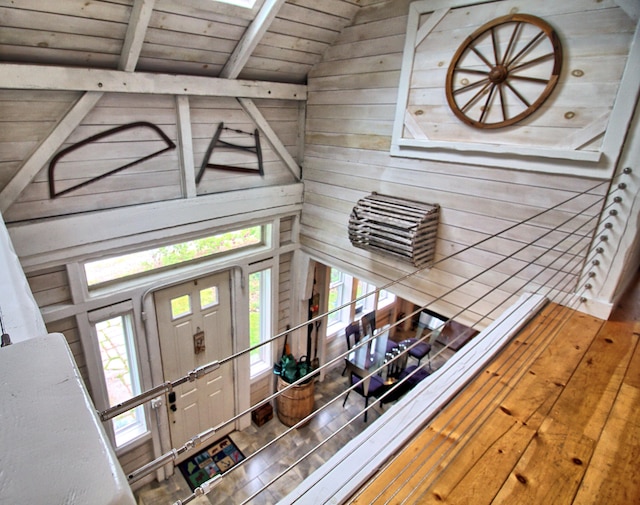 foyer featuring lofted ceiling with beams and wood ceiling