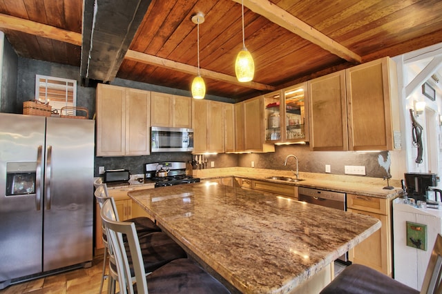 kitchen with sink, beamed ceiling, hanging light fixtures, stainless steel appliances, and light stone counters