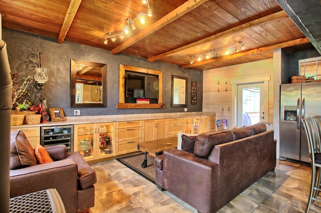 living room featuring beam ceiling, wooden ceiling, track lighting, and wine cooler