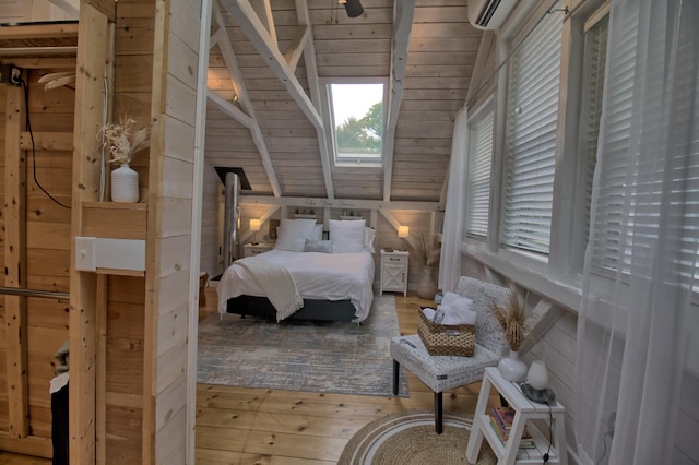 bedroom featuring hardwood / wood-style floors, wooden walls, wooden ceiling, a wall mounted air conditioner, and lofted ceiling with skylight