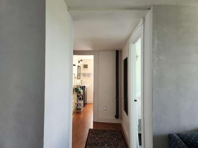 corridor featuring wood-type flooring