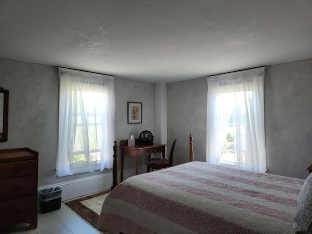 bedroom featuring multiple windows