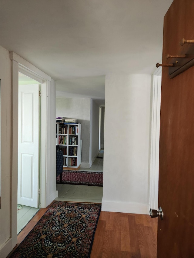 corridor featuring light hardwood / wood-style flooring