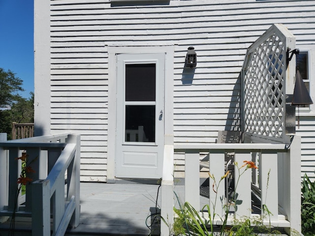 entrance to property with a deck