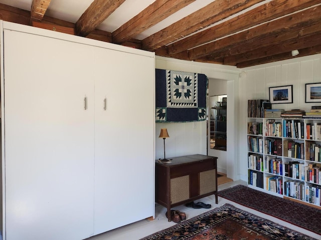 interior space featuring beam ceiling