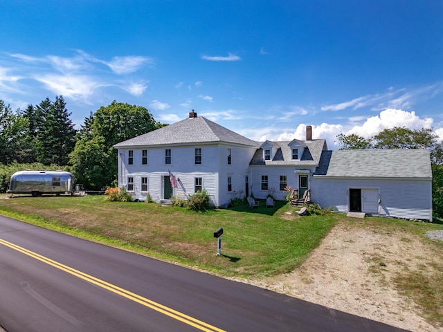 view of front of home with a front yard