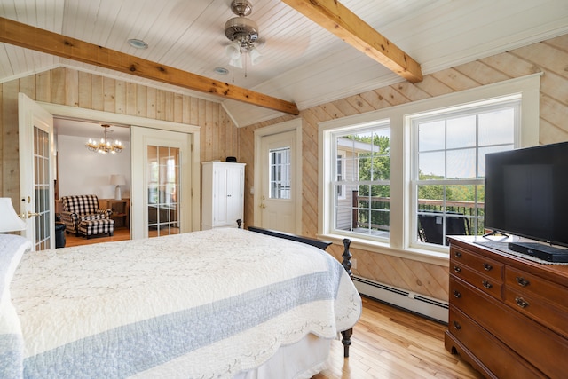 bedroom with light hardwood / wood-style floors, ceiling fan with notable chandelier, beamed ceiling, baseboard heating, and wooden walls