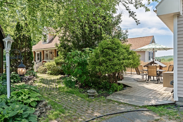 view of yard featuring a wooden deck