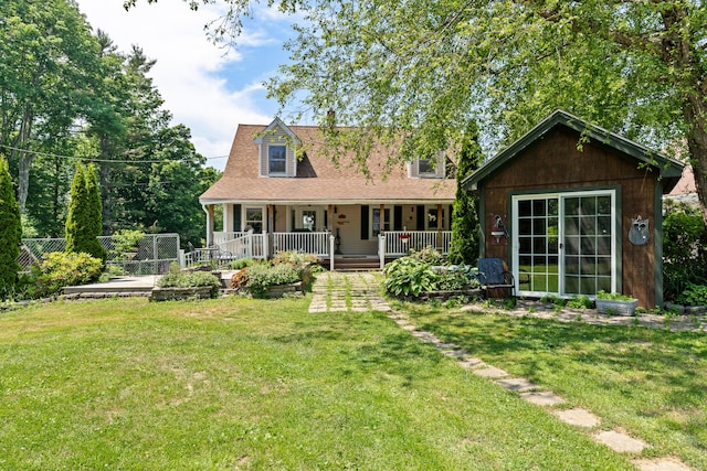 exterior space featuring covered porch and a front yard