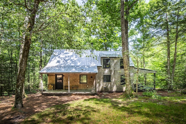 back of property featuring a yard and a patio