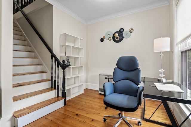 home office with wood-type flooring and ornamental molding