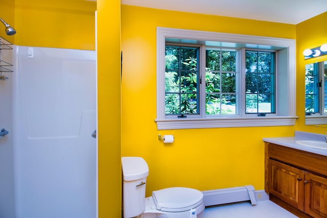 bathroom featuring tile patterned floors, a baseboard heating unit, vanity, toilet, and walk in shower