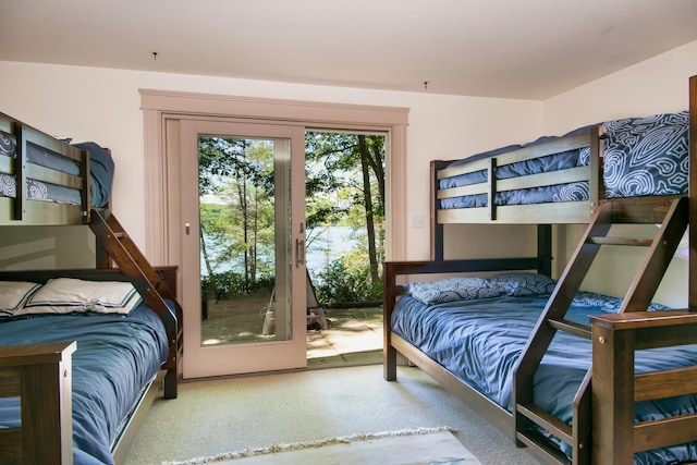 bedroom featuring access to exterior and carpet flooring