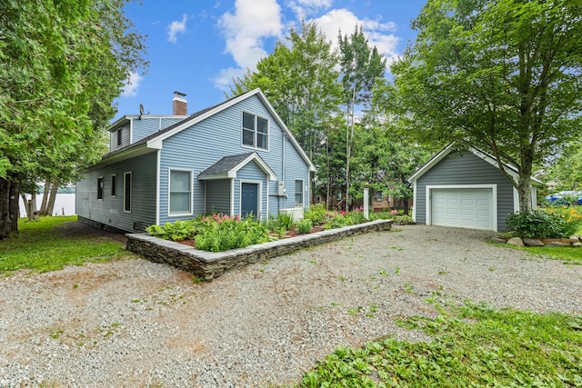 view of front of property with an outbuilding and a garage