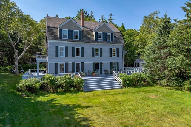 11 Bunkers Ledge Ln, Cranberry Isles, ME 04625 - back of property with a gambrel roof and a lawn