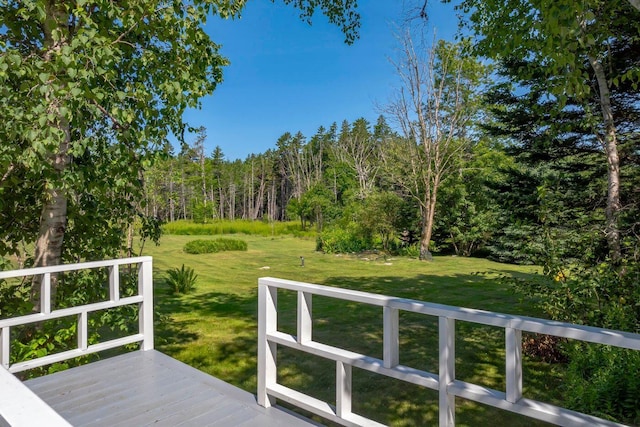 wooden deck with a yard