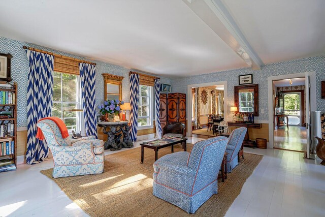 11 Bunkers Ledge Ln, Cranberry Isles, ME 04625 - living area featuring wallpapered walls, beam ceiling, and a wealth of natural light