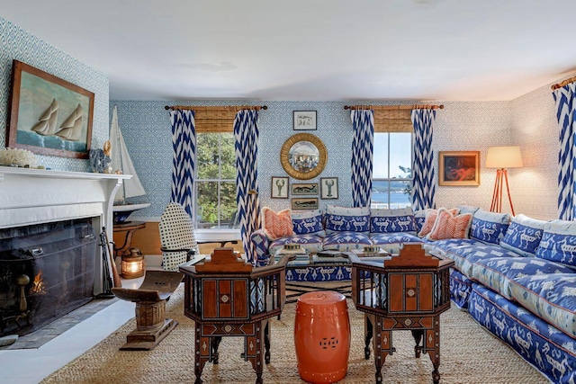 11 Bunkers Ledge Ln, Cranberry Isles, ME 04625 - living area with wallpapered walls and a lit fireplace