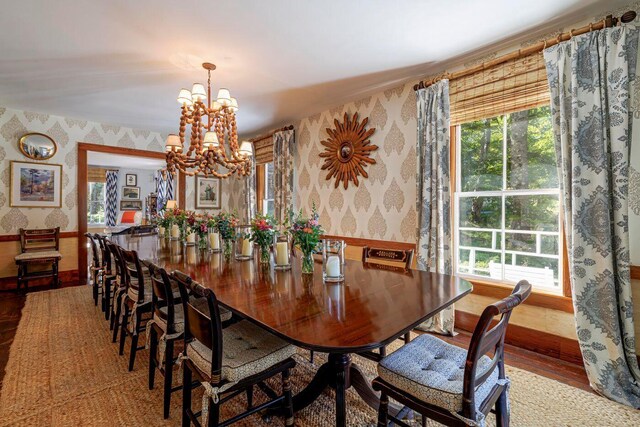 11 Bunkers Ledge Ln, Cranberry Isles, ME 04625 - dining room featuring a healthy amount of sunlight, wallpapered walls, and an inviting chandelier