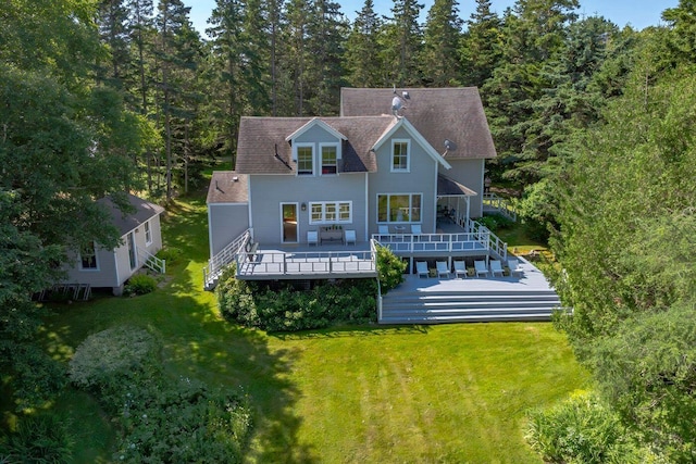 11 Bunkers Ledge Ln, Cranberry Isles, ME 04625 - rear view of house with a lawn, a shingled roof, and a wooden deck