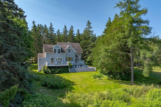 11 Bunkers Ledge Ln, Cranberry Isles, ME 04625 - rear view of property featuring stairs, a view of trees, a wooden deck, and a yard