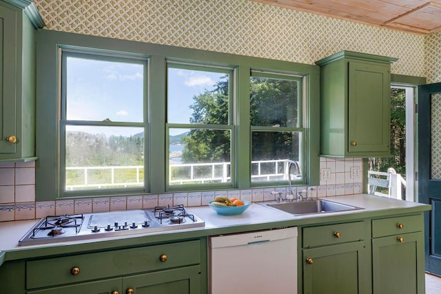 11 Bunkers Ledge Ln, Cranberry Isles, ME 04625 - kitchen featuring wallpapered walls, a sink, stainless steel gas stovetop, dishwasher, and green cabinetry
