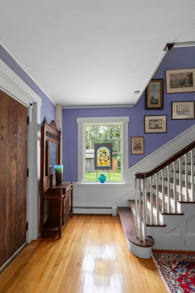 LTS23A Birch Is, South Bristol, ME 04568 - entryway featuring baseboard heating, hardwood / wood-style flooring, stairway, and vaulted ceiling