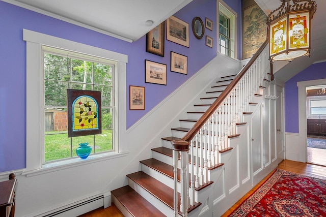 LTS23A Birch Is, South Bristol, ME 04568 - staircase with baseboard heating, wood finished floors, and crown molding