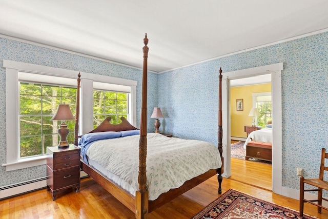 LTS23A Birch Is, South Bristol, ME 04568 - bedroom with a baseboard radiator, light wood finished floors, and wallpapered walls
