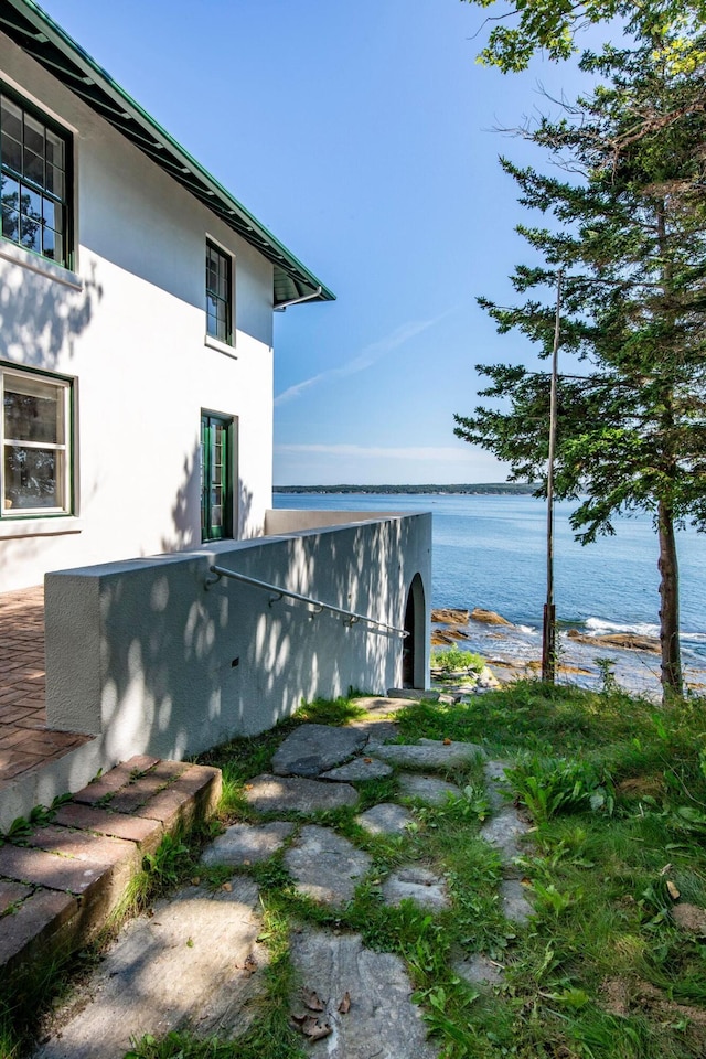 LTS23A Birch Is, South Bristol, ME 04568 - view of home's exterior featuring stucco siding and a water view