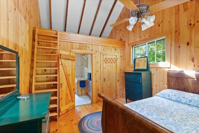 LTS23A Birch Is, South Bristol, ME 04568 - bedroom featuring wooden walls, lofted ceiling, and hardwood / wood-style floors