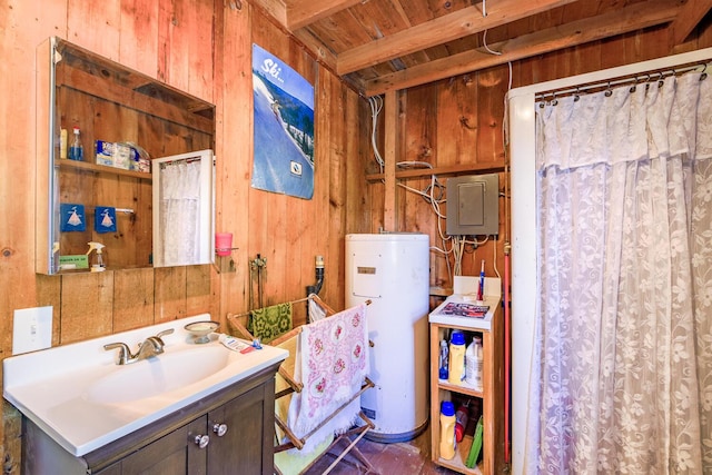 bathroom with vanity, wooden walls, electric panel, and gas water heater