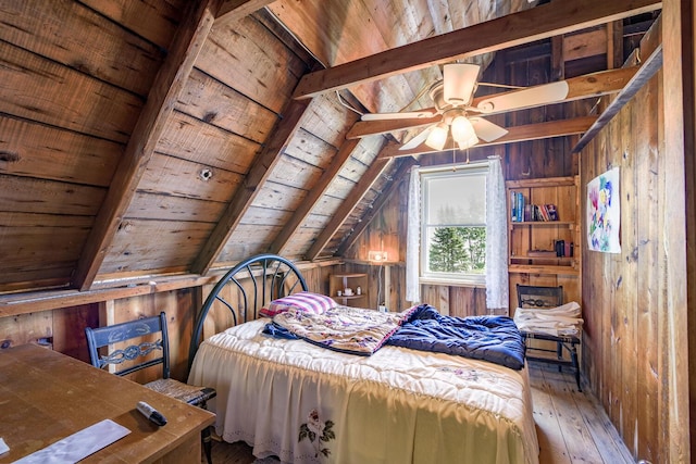 bedroom with wood ceiling, wooden walls, lofted ceiling with beams, and wood-type flooring