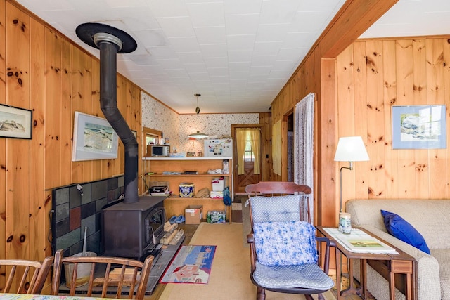 sitting room featuring a wood stove