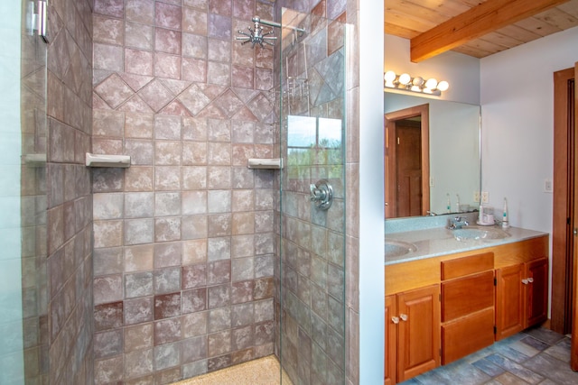 bathroom featuring beam ceiling, vanity, wooden ceiling, and tiled shower