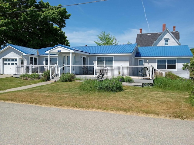 view of front facade featuring a garage and a front lawn